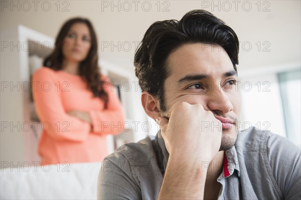 Couple arguing in living room