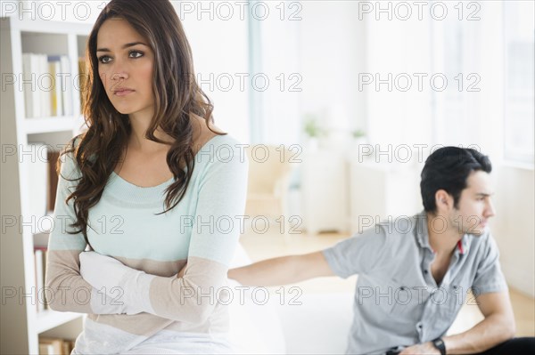 Couple arguing in living room