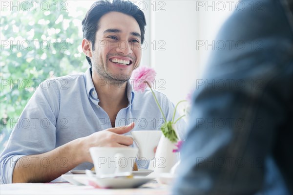 Couple eating breakfast together