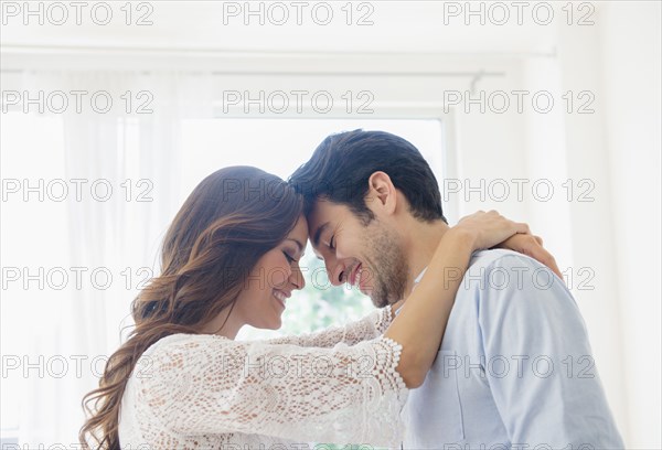 Smiling couple hugging