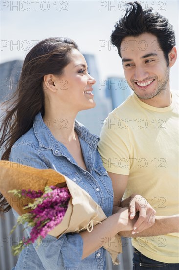 Couple walking together on city street