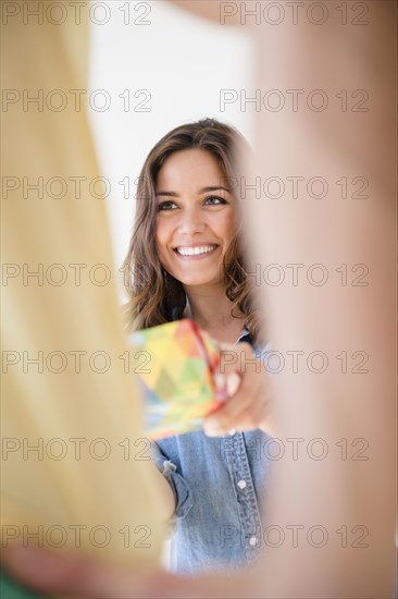 Woman giving boyfriend gift