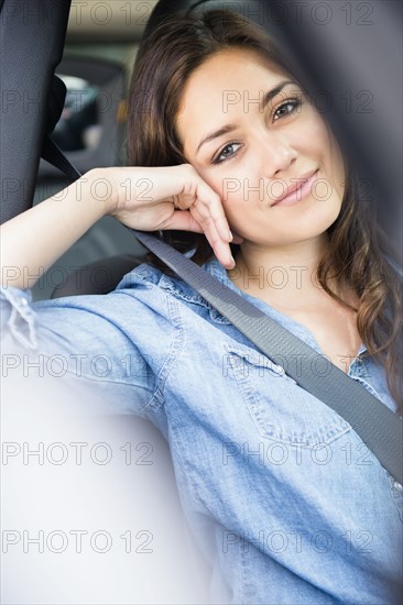 Woman smiling in car