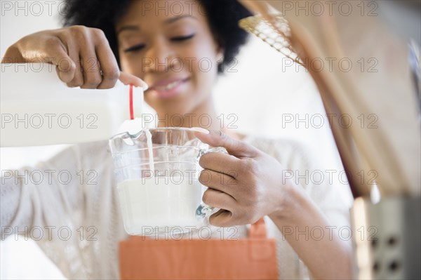 African American woman cooking in kitchen