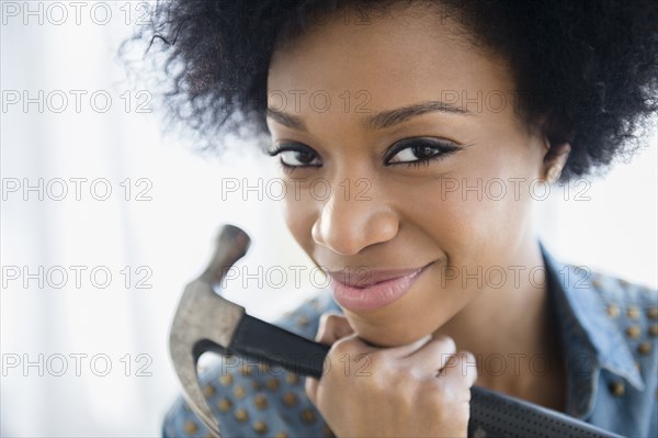 African American woman holding hammer