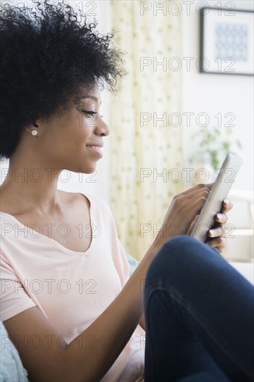 African American woman using tablet computer