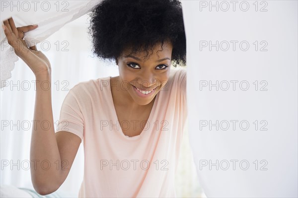 African American woman playing with blanket