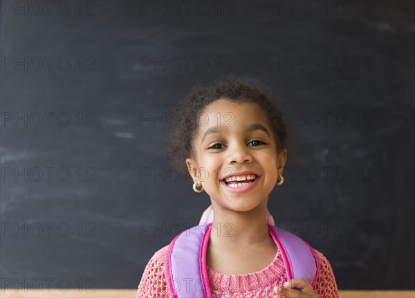 African American girl smiling in classroom