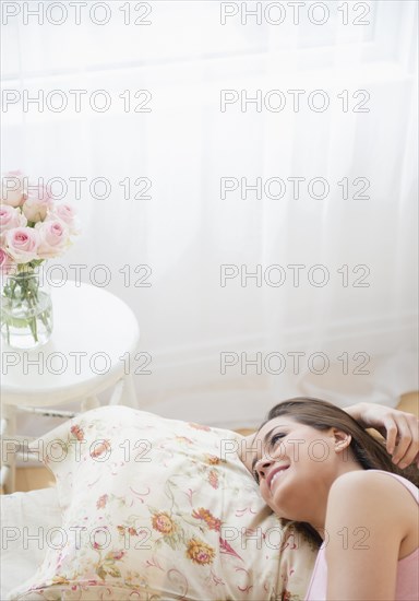 Woman relaxing on bed