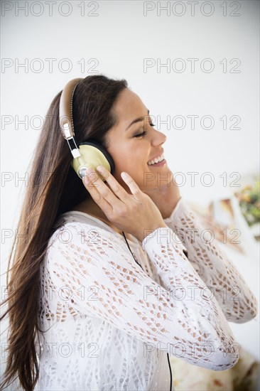 Woman listening to headphones