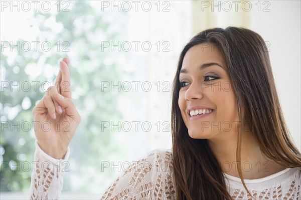 Woman crossing her fingers