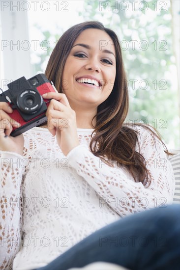 Woman taking pictures with camera