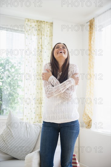 Woman smiling in living room