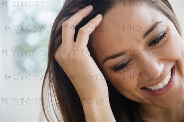 Woman running fingers through her hair