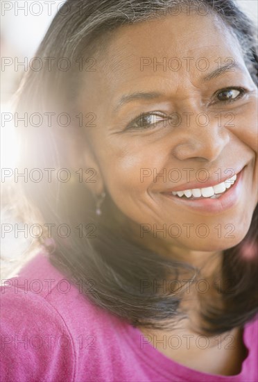 Close up of mixed race woman smiling