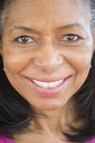 Close up of mixed race woman smiling