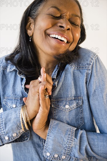 Mixed race woman cheering