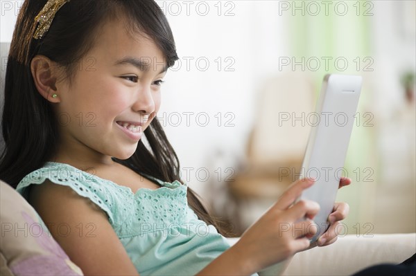 Filipino girl using tablet computer