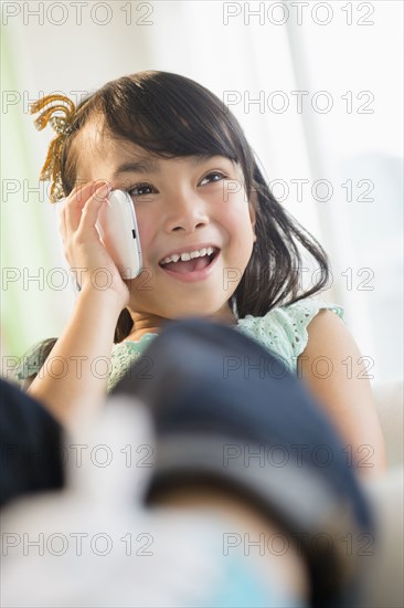 Filipino girl talking on cell phone