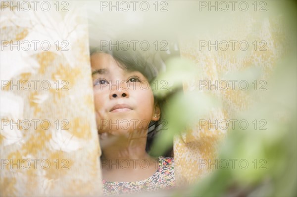Filipino girl looking out window