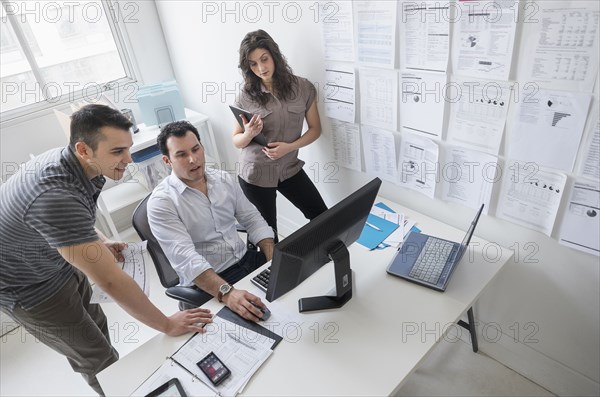 Hispanic business people working together in office