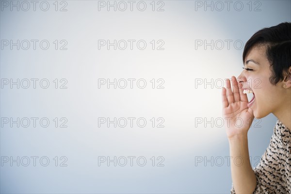 Close up of mixed race woman shouting