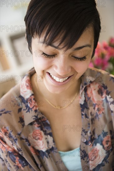 Close up of mixed race woman's smiling face