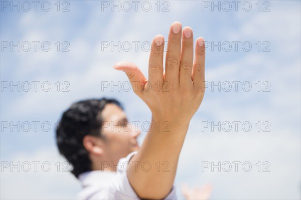 Close up of mixed race man with arms outstretched