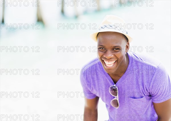 Mixed race man at beach