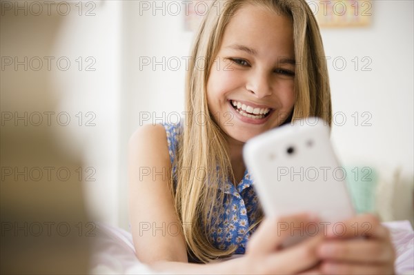 Caucasian girl using cell phone