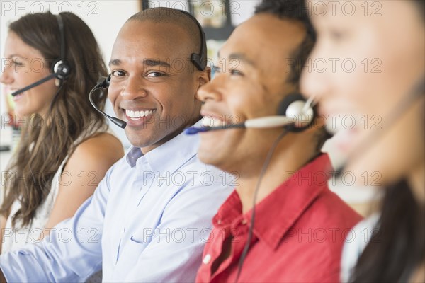 Businessman wearing headset in office