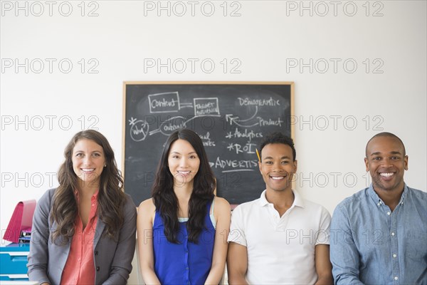 Business people smiling in office