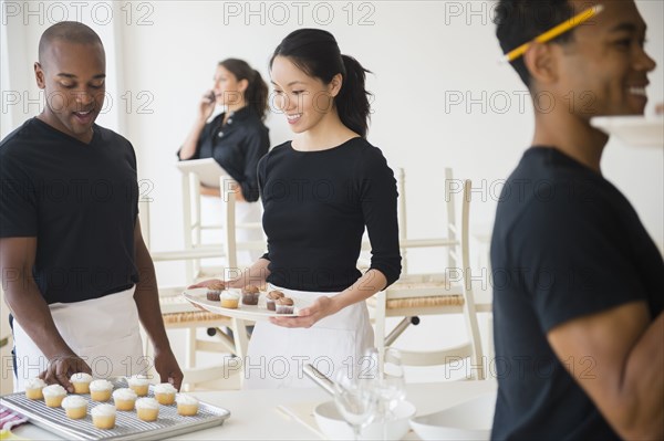 Caterers working together in event space