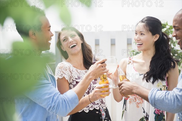 Friends toasting each other at party