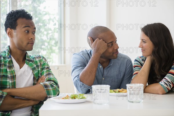 Man surprised at friends flirting