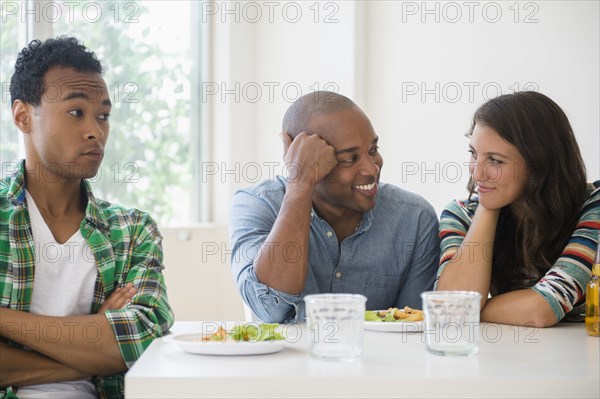 Man surprised at friends flirting