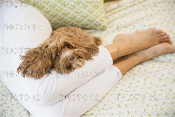 Caucasian woman relaxing with pet dog