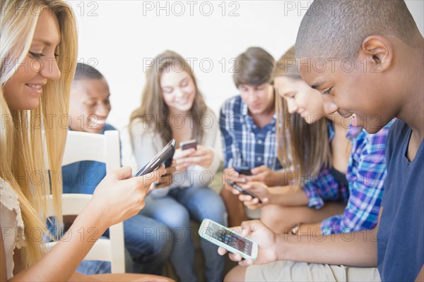 Teenagers using cell phones