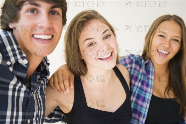 Teenagers hugging and smiling