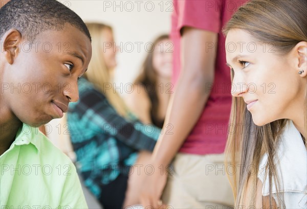 Teenagers face to face at party