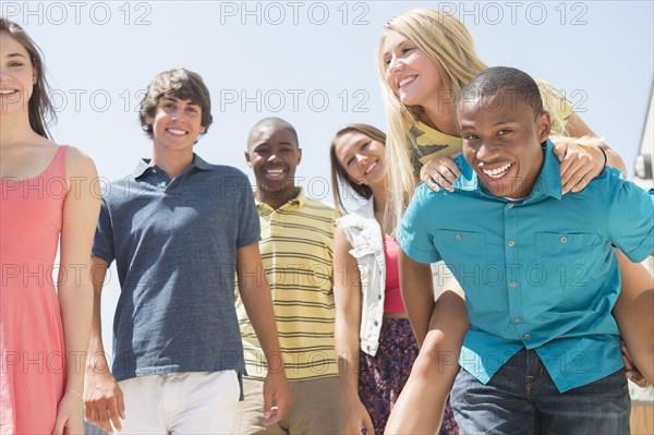 Teenagers standing together outdoors