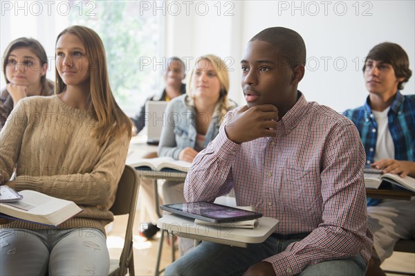 Teenage students listening in classroom