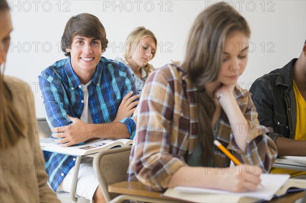 Teenage student smiling in classroom