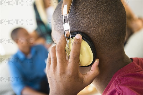 Teenage boy listening to headphones