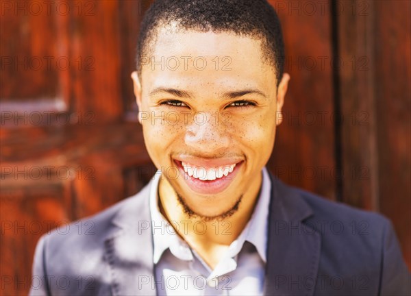 Black businessman smiling outdoors