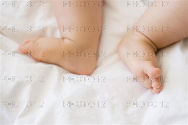 Close up of feet of mixed race baby