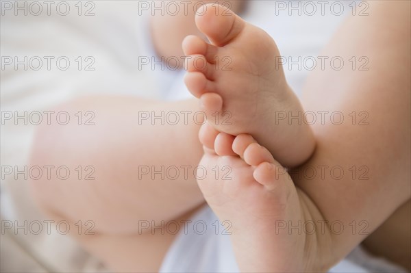 Close up of feet of mixed race baby