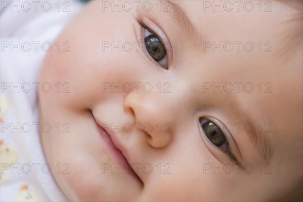Close up of smiling mixed race baby