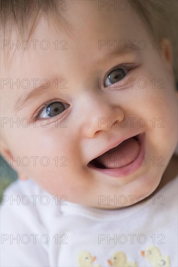 Close up of smiling mixed race baby