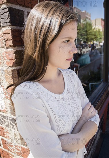 Close up of upset Caucasian woman with arms crossed